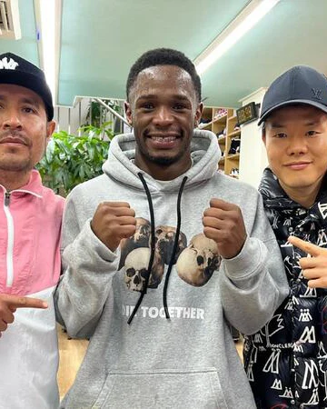 John Masamba poses with his fists raised during his move to train in Japan.